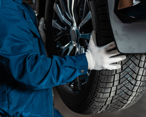 Service Technician removing a wheel